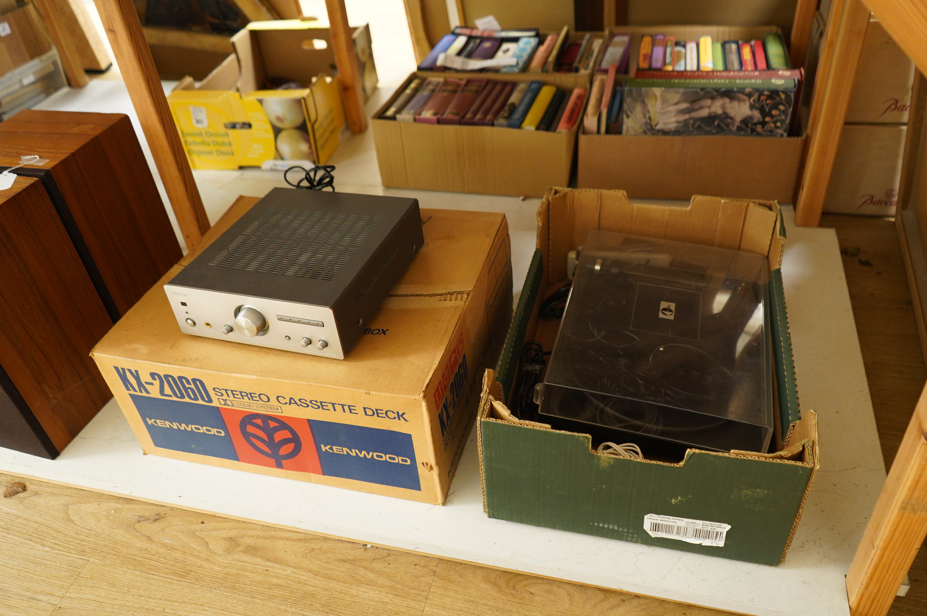 A collection of stereo equipment, including a Project P1 turntable record player, a Denon UPA-F10 integrated stereo amplifier with remote control, a boxed Kenwood KX-260 cassette tape player and a pair of Monitor Audio s